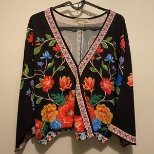 Flying Tomato, black blouse with colorful flowers.